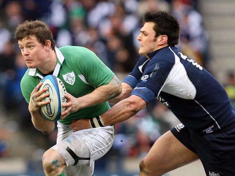 Rob Dewey tackles Brian O'Driscoll during the Six Nations Championship