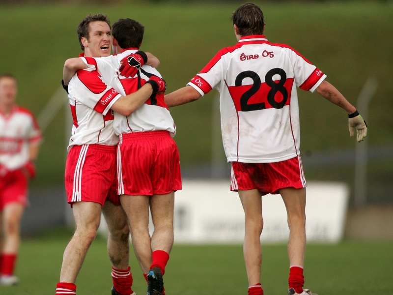 Éire Óg's Paul Cashin, James Reilly and Sean Gannon celebrate at the final whistle
