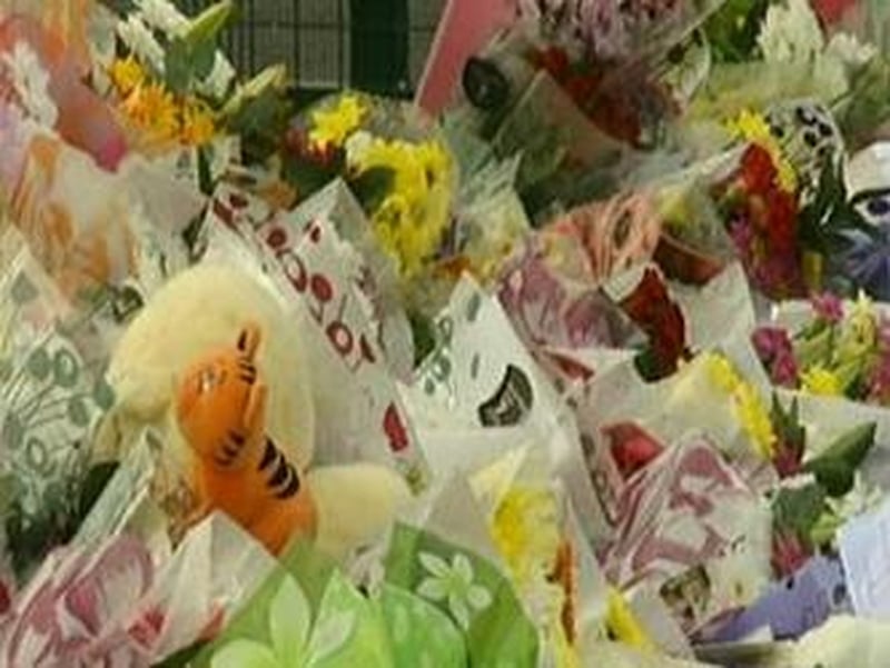 Flowers for Omagh victims - Families hope civil case concludes by tenth anniversary of the bombing