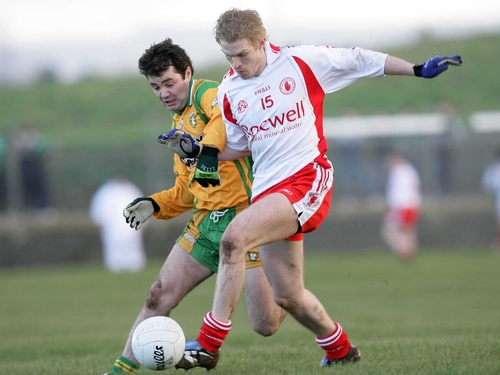 Tyrone's Sean O'Neill &amp; Niall McCready of Donegal tussle for possesion