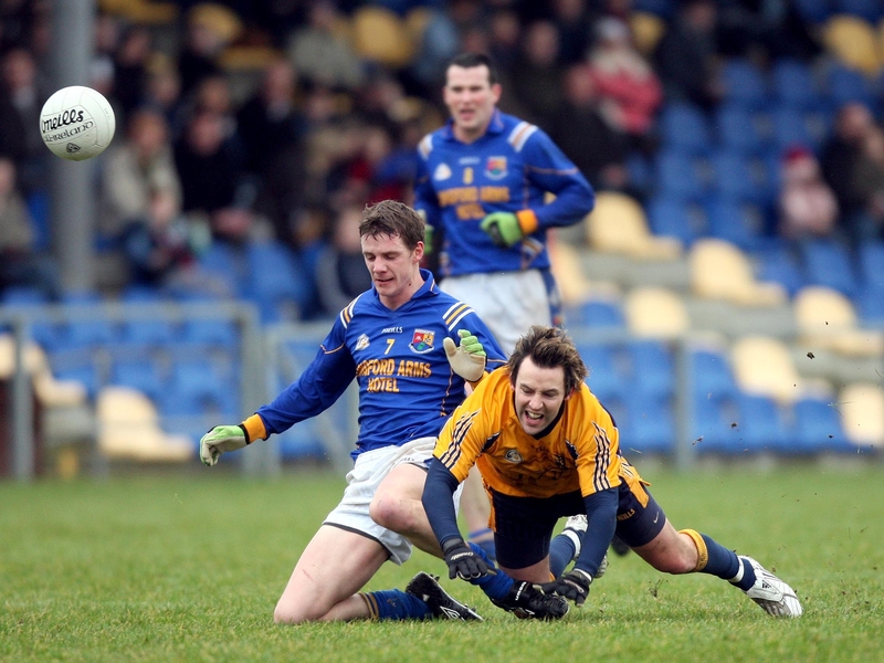 Noel Farrell and Conor Mortimer do battle in Pearse Park