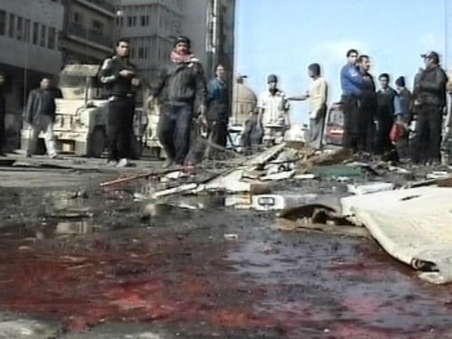 Baghdad - 98 killed in market blasts
