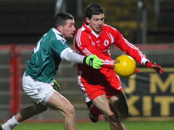 Tyrone's PJ Quinn is challenged by Kildare's Andrew McLoughlin