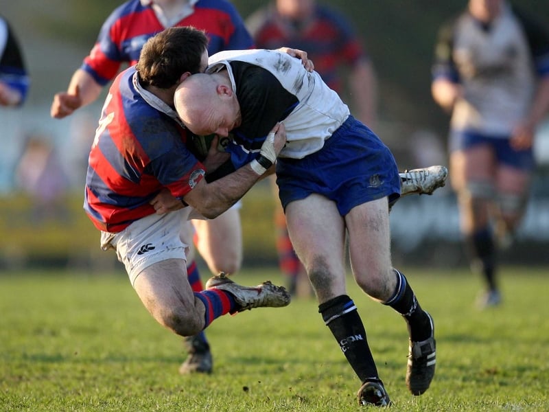 Clontarf's Max Rantz McDonald tackles Cronan Healy of Cork Con