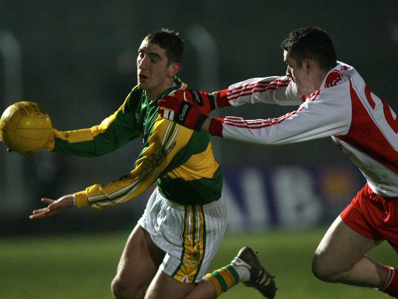 Kerry's Killian Young evades the tackle of Damien McCaul from Tyrone in tonight's clash in Tralee