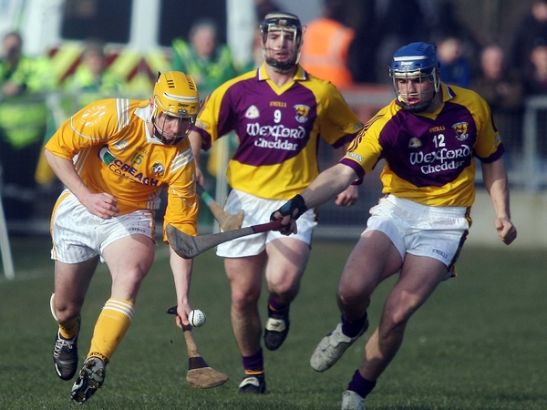 Antrim's Simon McCory tries to evade Wexford's John O'Connor (centre) and Stephen Nolan