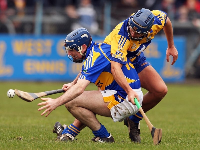 Tipperary's Eoin Kelly (l) tussles with Gerry O'Grady of Clare