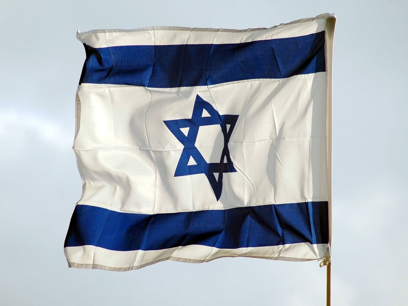 Israeli border police shot at a Palestinian holding a petrol bomb