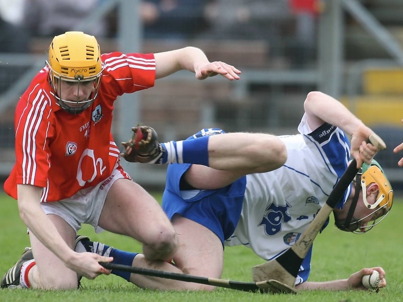 Cathal Naughton, who scored one of Cork's goals, tangles with Aidan Kearney at Walsh Park