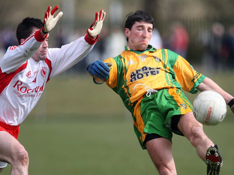 Ryan McMenamin tries to block a shot by Donegal's Michael Hegarty