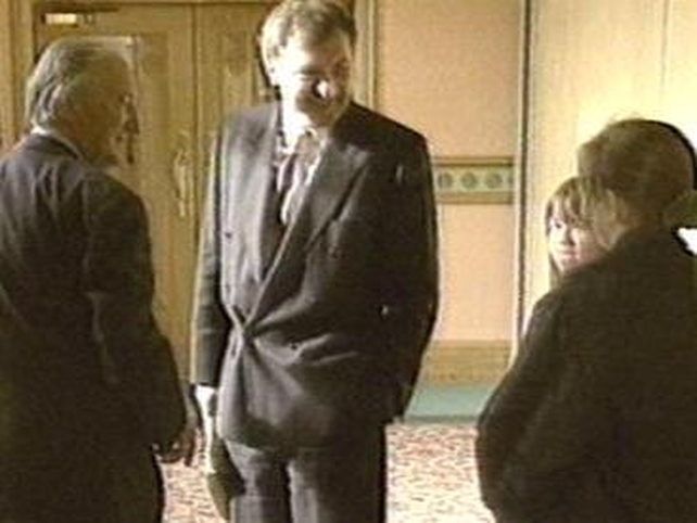 Ahern and his mentor Charles Haughey speak with a pair of schoolgirls