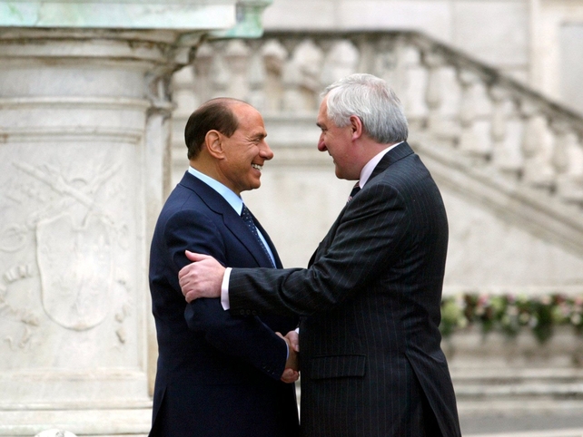 With then-Italian Prime Minister Silvio Berlusconi October 2004