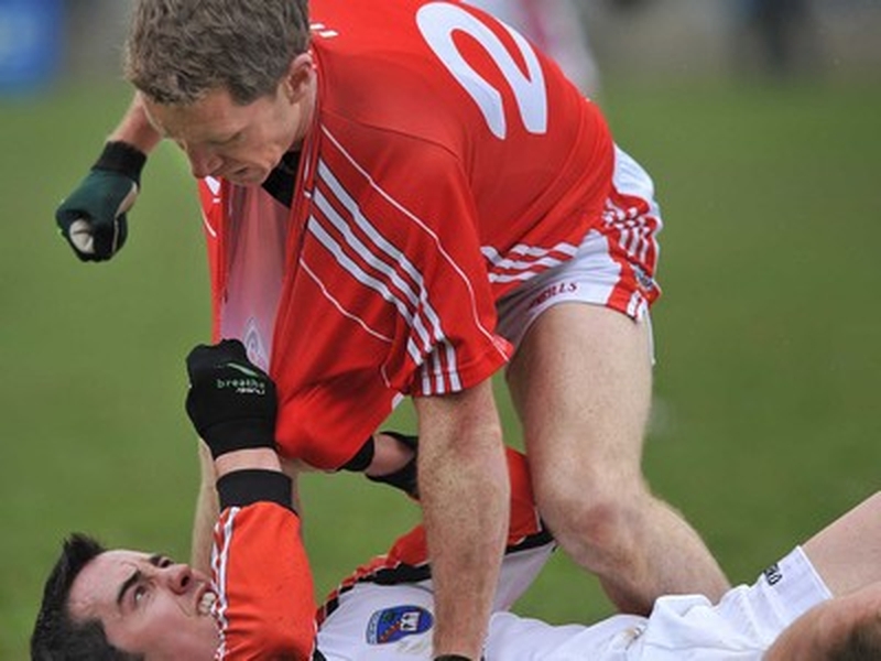 Cork's Conchur McCarthy, and Armagh's Stephen Kernan, grounded, tussle during the match