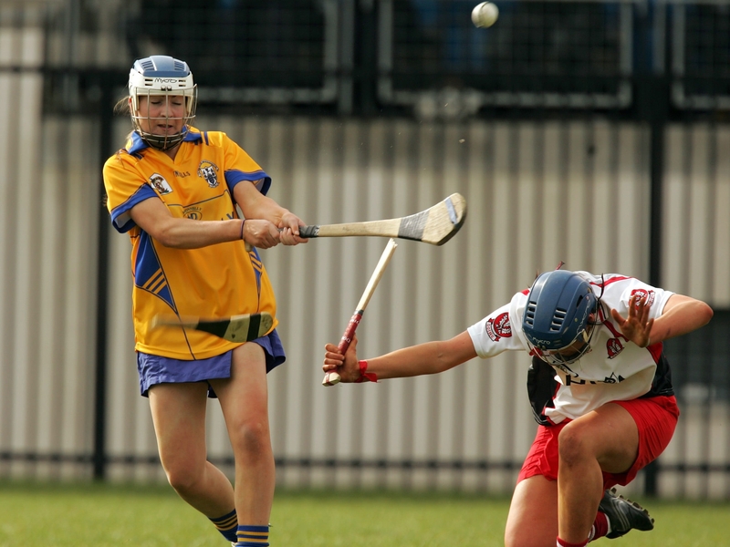 Clare's Calre Scanlon gets in a clearence despite the attentions of Derry's Aisling Diamond in the Division 2 decider