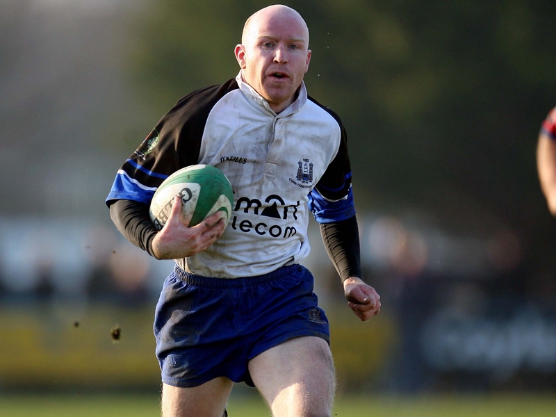 Cronan Healy scored a brace of tries as Cork Con went top of the Division One table