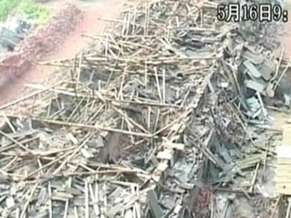 China - Flattened cities and towns need clearing after quake