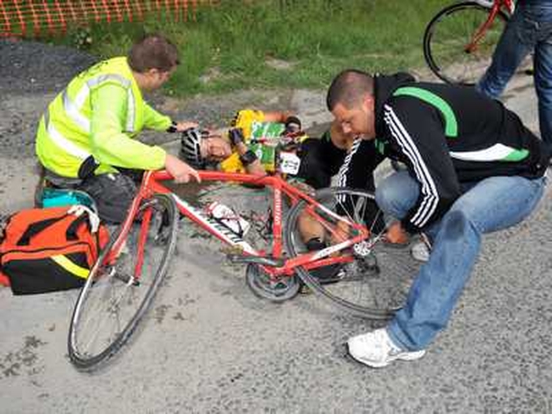 Mark Cassidy is treated after crashing at a level-crossing as the riders went through Co Limerick