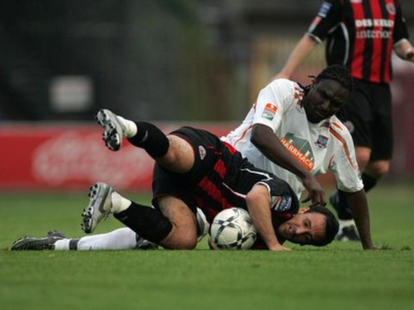 Bohs Neale Fenn and Wes Charles of Galway tussel for the ball