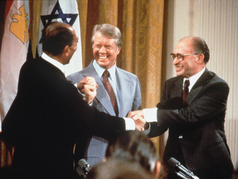 Nuclear Revelations - Former US President Jimmy Carter, seen here sealing a deal between Israel and Egypt in 1978, confirmed Israel's nuclear arsenal on Sunday