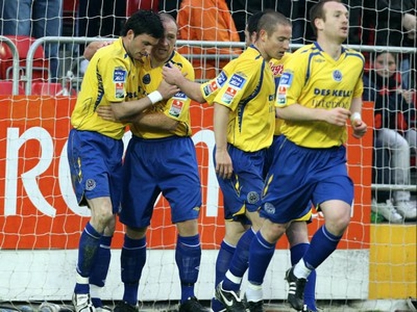 Killian Brennan is congratulated by his teamates after scoring the goal that gave St Pat's three points
