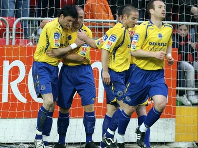 Killian Brennan is congratulated by his teamates after scoring the goal that gave St Pat's three points