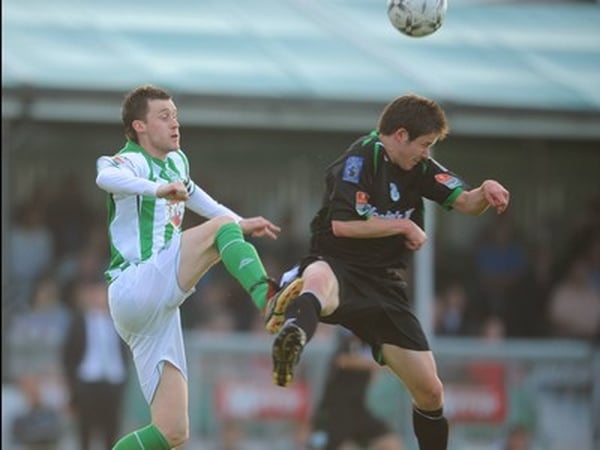 Alan Cawley of Bray Wanderers competes for the ball with Rovers' Eric McGill