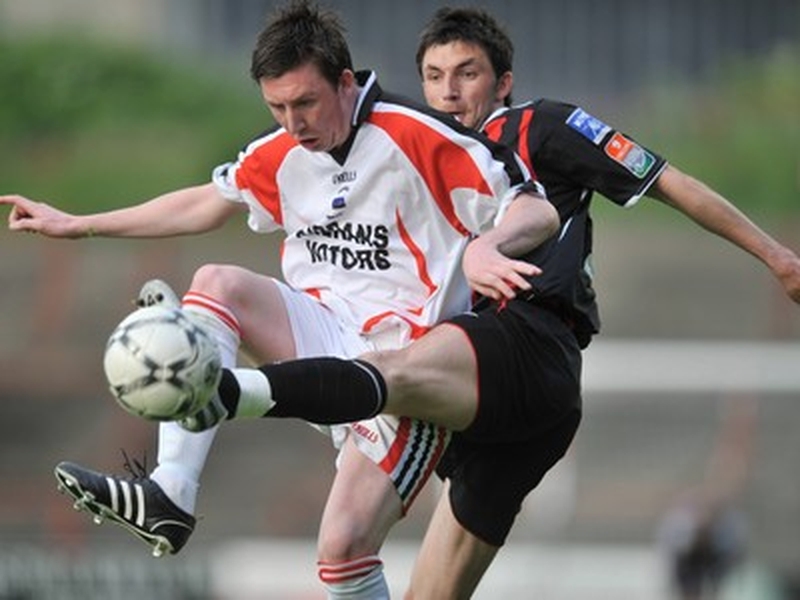 Brothers Sean and Killian Brennan tussle for the ball