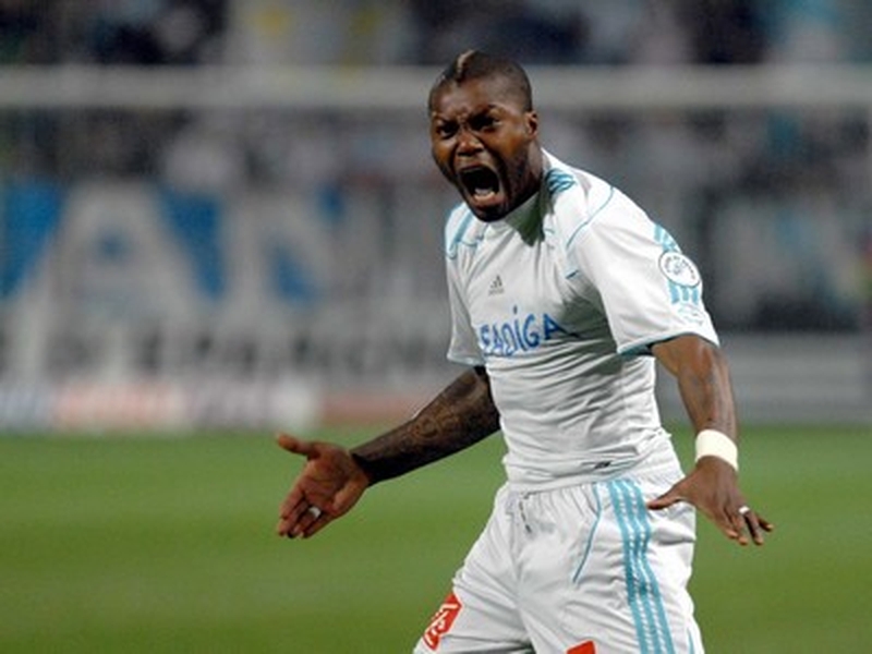 Djibril Cisse celebrates after scoring for Olympique Marseille
