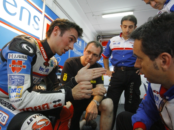 Eugene Laverty in discussion with team mates in the paddock