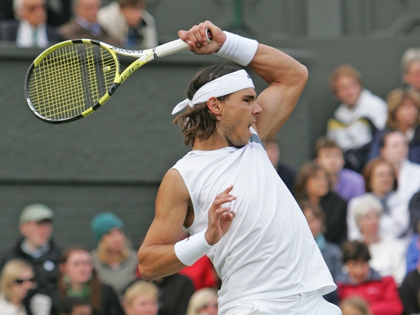 Rafael Nadal survived losing the opening set to Ernests Gulbis to go through to meet Nicolas Kiefer in round three