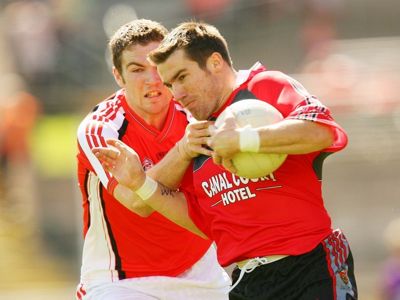 Brendan Donaghy of Armagh and Down's Ronan Murtagh in action in Clones today