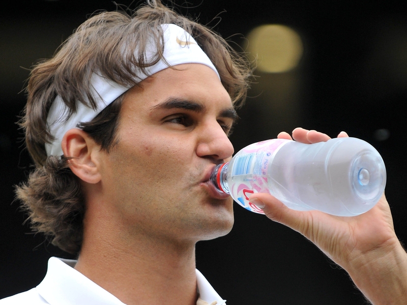 Roger Federer takes a cold drink druing today's quarter-final