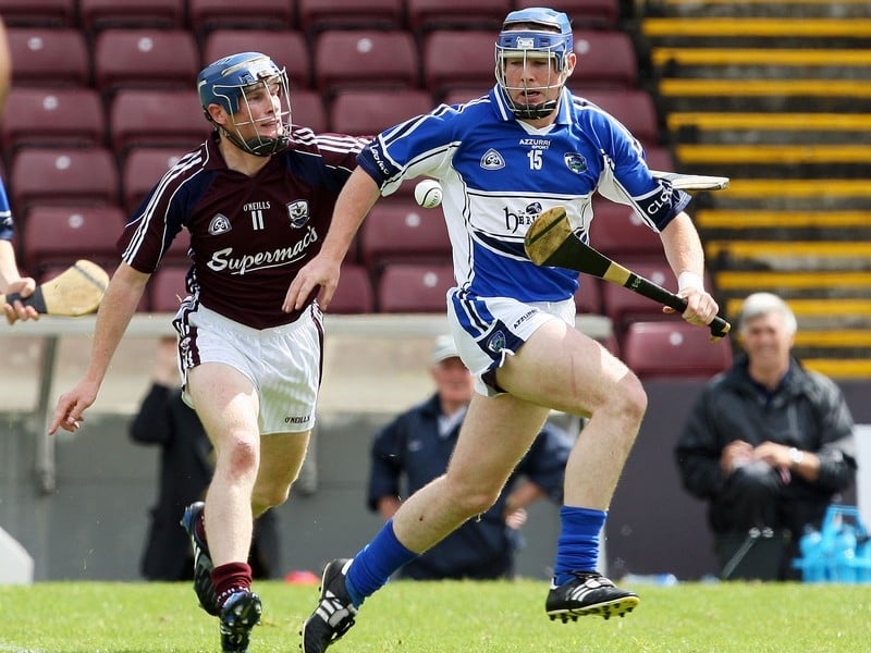 Galway's Cyril Donnellan and Willie Hyland of Laois battle for possession