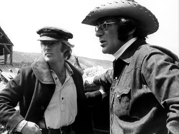 Redford (left) - Paid tribute to friend Sydney Pollack (right)