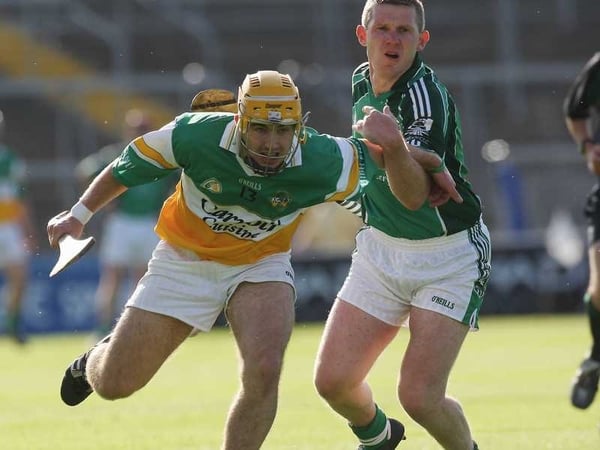 Offaly's Brian Carroll and Mark Foley of Limerick tussle at the Gaelic Grounds