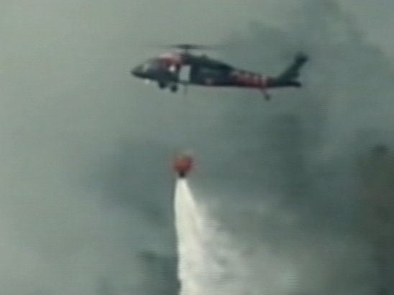 California - Firefighters tackling wildfire