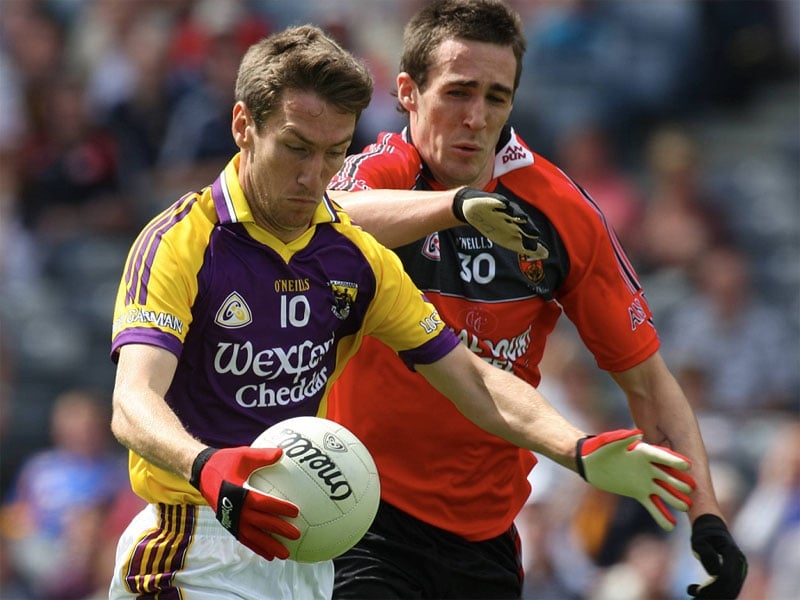 Wexford's Redmond Barry and Dan Gordon of Down tussle at Croke Park