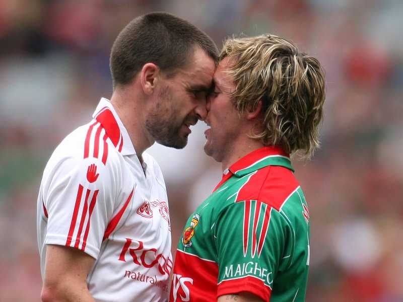 Tyrone's Ryan McMenamin and Conor Mortimer of Mayo square up to each other