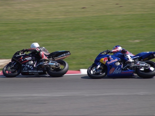 Eugene Laverty on the Red Bull Supersports machine chases Craig Jones at a BSB race at Snetterton in 2005