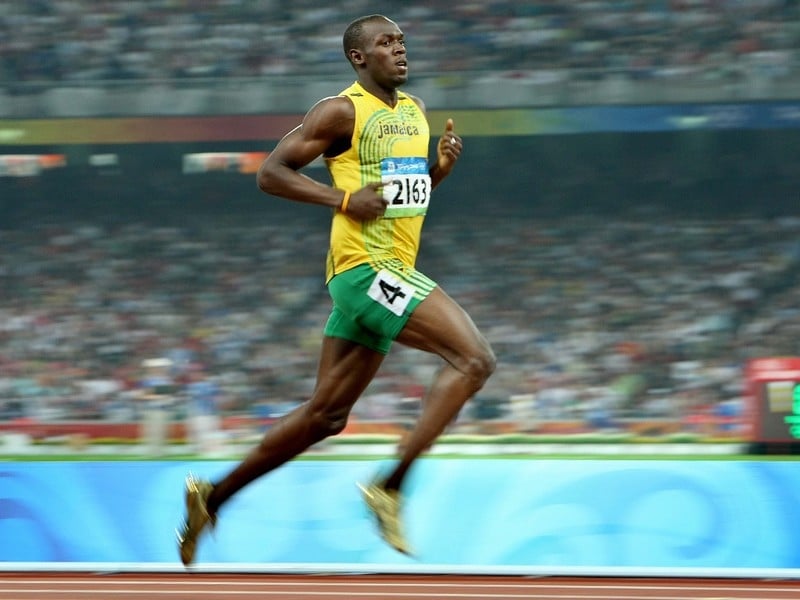 Usain Bolt cantered into the second round of the 100m in Berlin