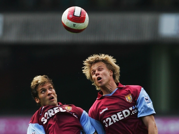 Aston Villa captain Martin Laursen (r) almost grabbed a late winner against Liverpool