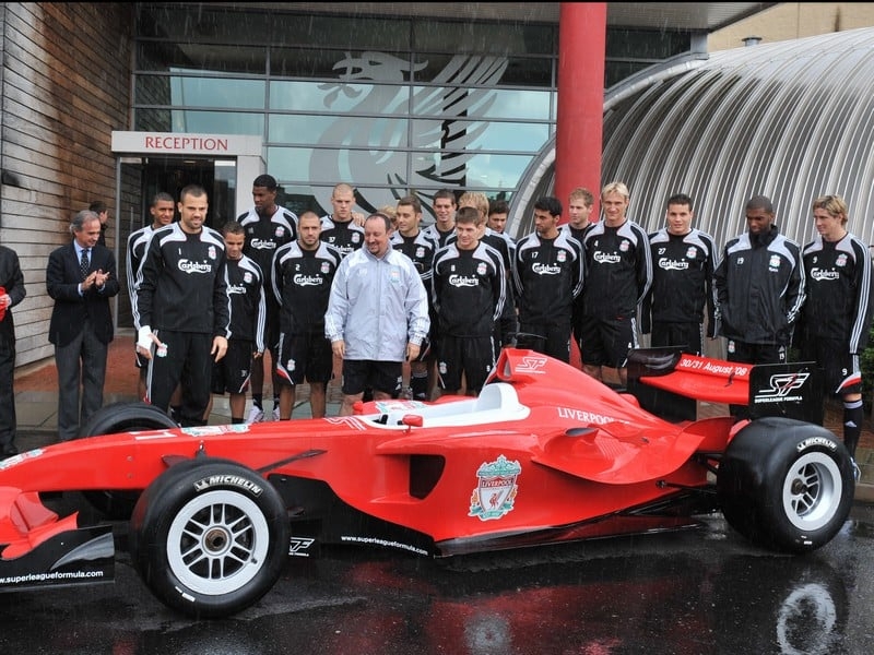 Liverpool players eye up the stereo in the new Superleague Formula car