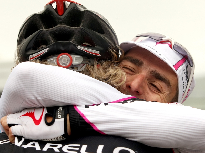 Russell Downing hugs team-mate Malcolm Elliot after his victory