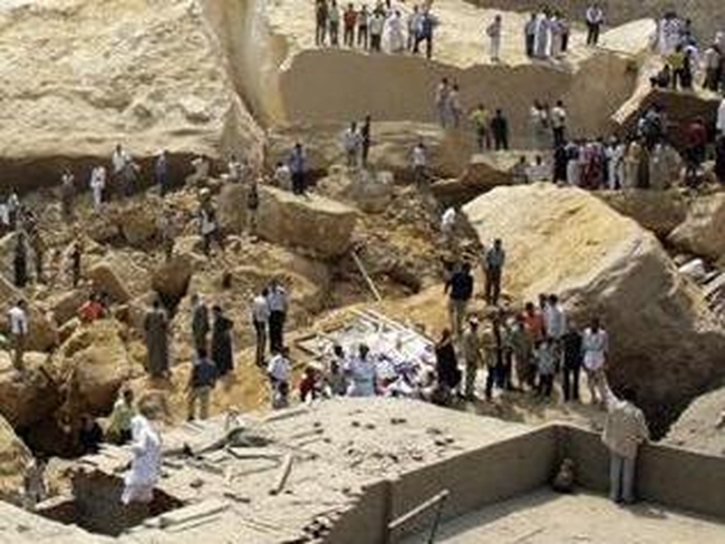 Cairo - Rescue workers look for survivors