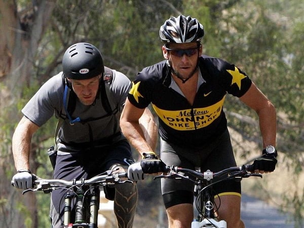 The impending arrival of Lance Armstrong (r) is creating a huge buzz in Australia