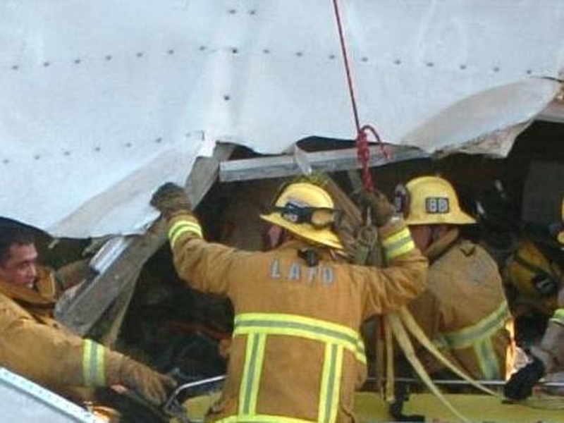 Trapped - Rescue teams work to remove victims from crashed train