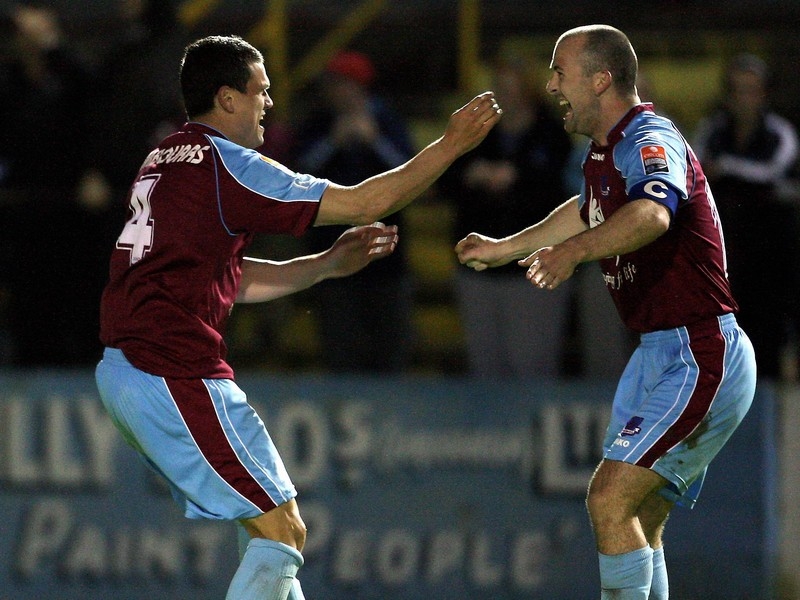 John Tambouras celebrates his equalizer with Paul Keegan