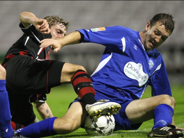 Declan Boyle of Harps tussles with Mindagu Kalonas of Bohemians