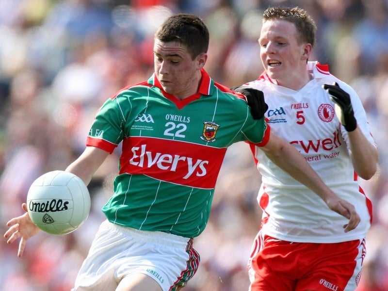Mayo's Kieran Charlton gets a kick away under pressure from Stephen McRory of Tyrone