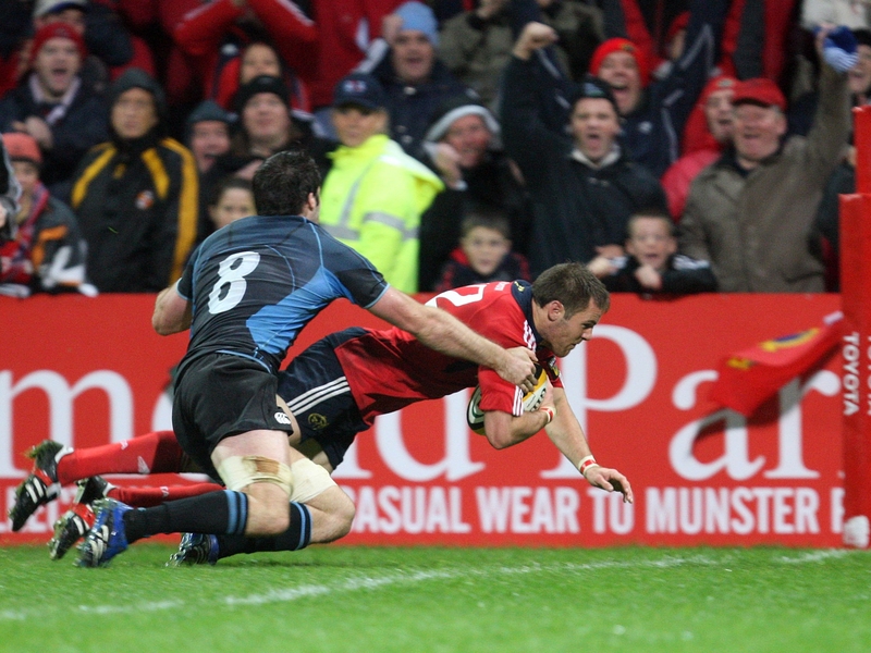 Munster's Barry Murphy scores a try despite the efforts of John Beattie of Glasgow